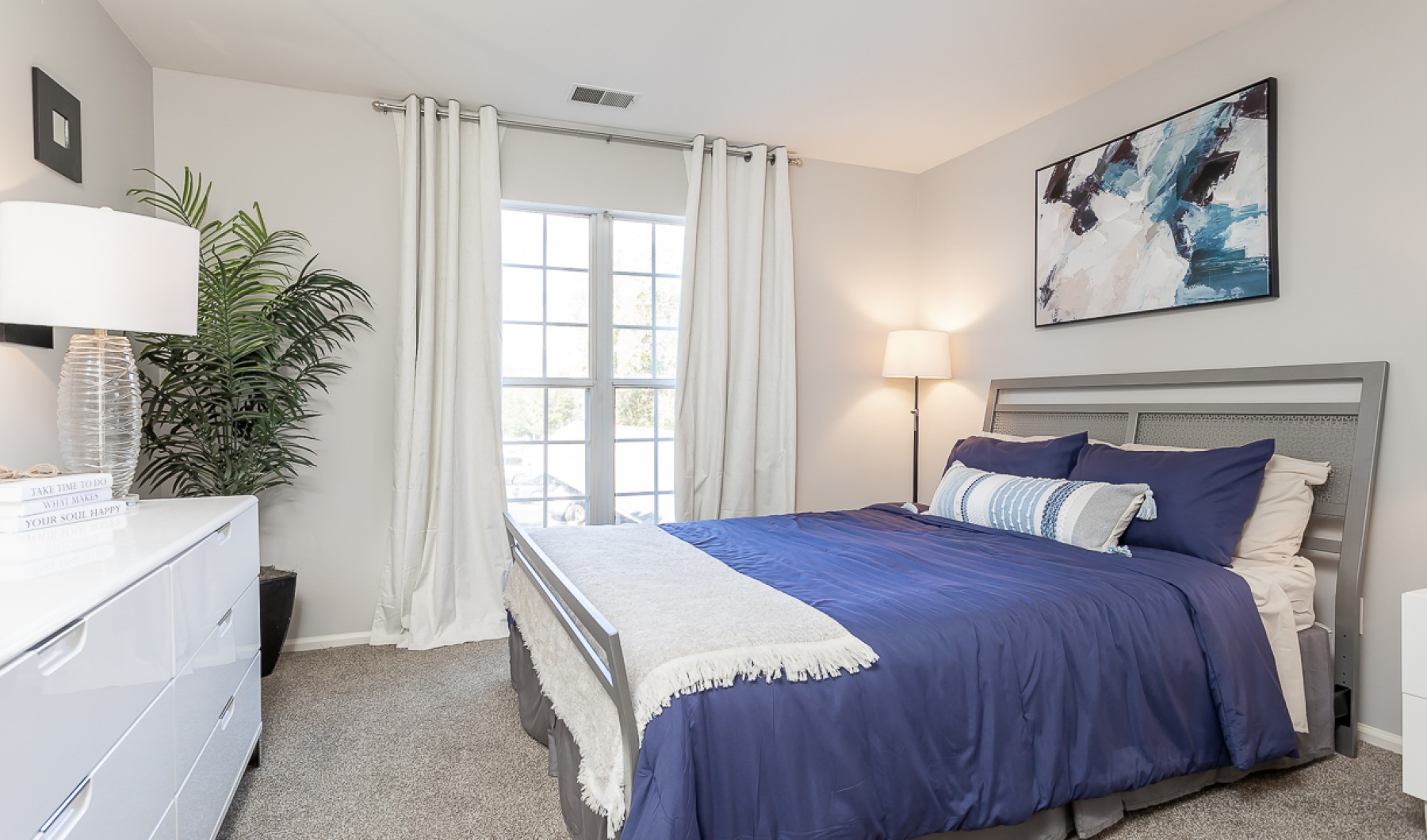 Unleash your style in large bedrooms Styled bedroom with blue bedding